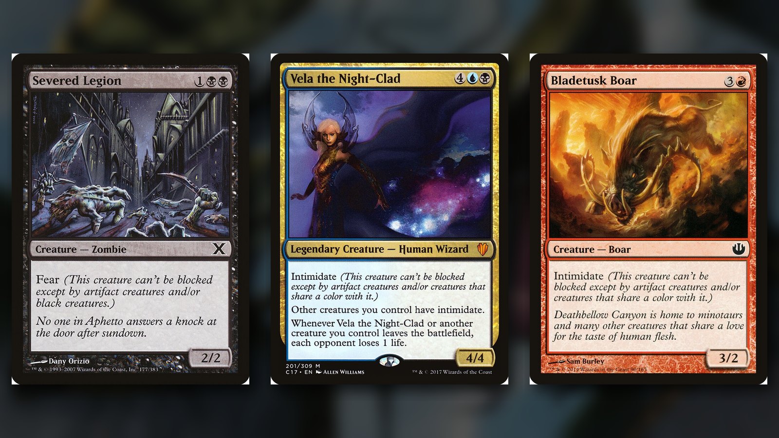 Three MTG cards side by side: Severed Legion with fear, Vela the Night-Clad and Bladetusk Boar with intimidate, over a dark blurred background